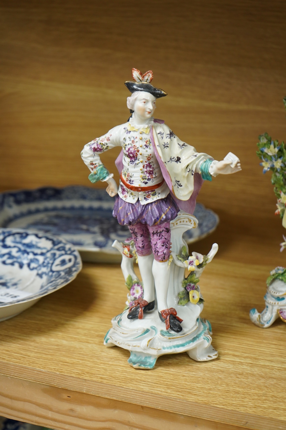 A Derby figure of a gentleman, c.1760, and a Continental porcelain figure, pseudo Bow mark, tallest 26cm high (2)